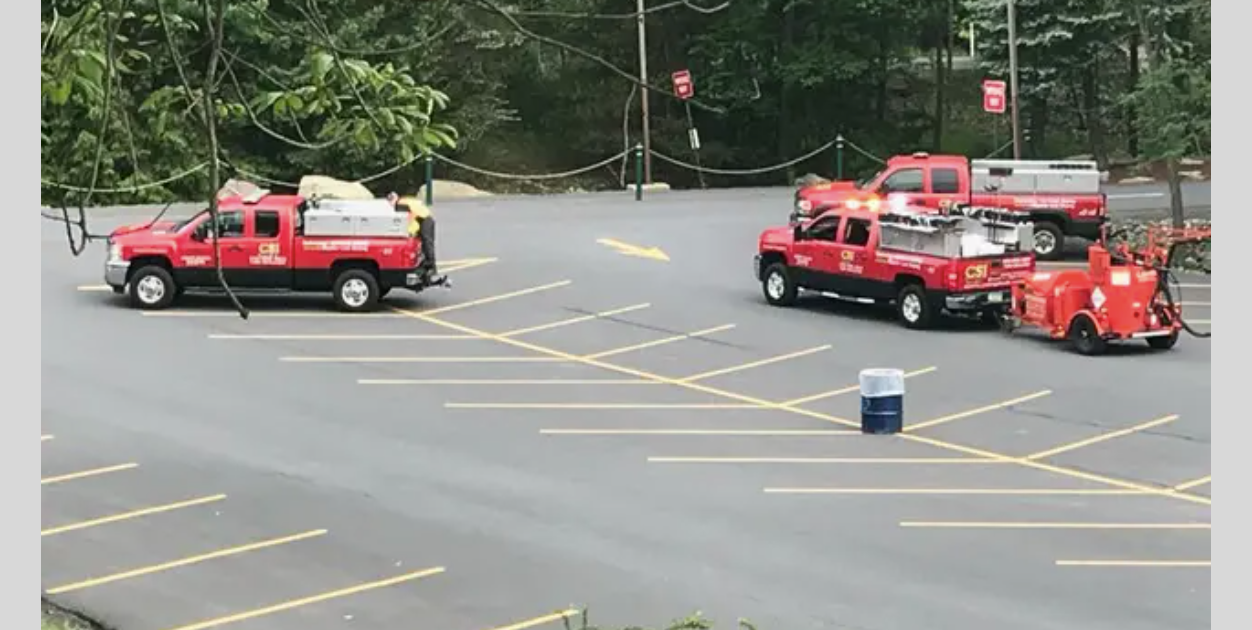 CSI Asphalt fleet on a freshly sealed and striped lot