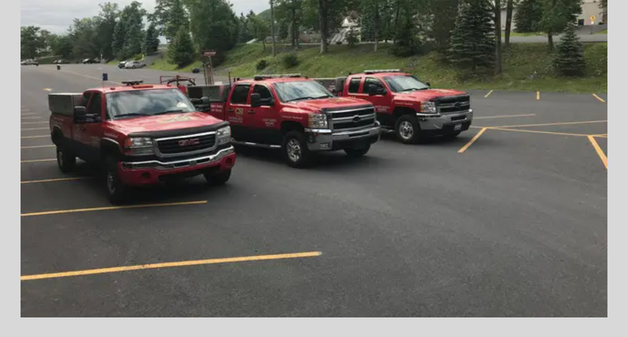 CSI Asphalt trucks staged on a finished lot